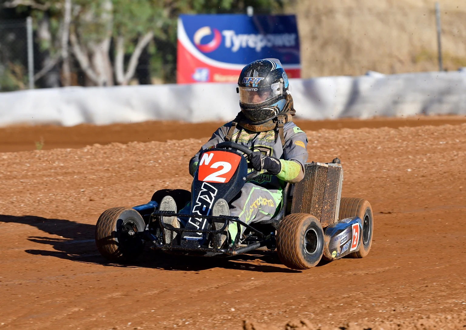 Finnigan Hunter driving his N2 dirt kart on track
