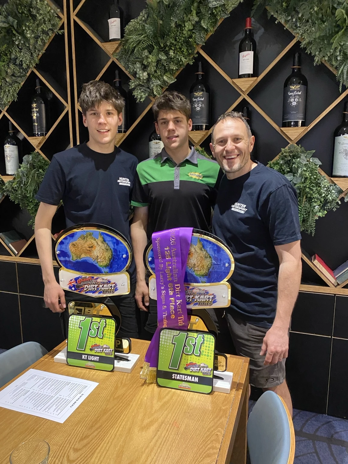Hunter Motorsport celebrating two Australian dirt kart championship wins with trophies